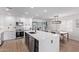 Renovated kitchen features modern appliances, a huge waterfall island, and a breakfast area at 8522 E Virginia Ave, Scottsdale, AZ 85257