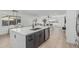 Modern kitchen features white countertops, gray cabinets, stainless steel appliances, and open concept living area at 8522 E Virginia Ave, Scottsdale, AZ 85257