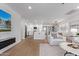 Bright, open living space with modern kitchen, island, and stylish furnishings, with hardwood style floors throughout at 8522 E Virginia Ave, Scottsdale, AZ 85257