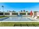 Sparkling pool with mosaic tile wall in backyard at 8522 E Virginia Ave, Scottsdale, AZ 85257