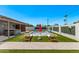 Backyard pool with lawn chairs and red umbrella for relaxing on a hot day at 8522 E Virginia Ave, Scottsdale, AZ 85257