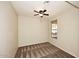 Comfortable bedroom with a ceiling fan and a large window providing natural light at 10065 E Tiger Lily Ave, Mesa, AZ 85212