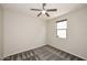 Bedroom featuring neutral paint, carpet, a ceiling fan, and a window for ample light at 10065 E Tiger Lily Ave, Mesa, AZ 85212