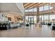 Common area showcasing a spacious layout, modern design, bar seating, natural light, and outdoor views at 10065 E Tiger Lily Ave, Mesa, AZ 85212