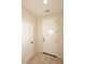 Bright entryway featuring neutral walls, tile flooring, and a large front door and closet at 10065 E Tiger Lily Ave, Mesa, AZ 85212