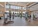 Well-equipped fitness center featuring modern exercise machines and large windows with views for an invigorating workout at 10065 E Tiger Lily Ave, Mesa, AZ 85212