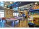 Game room featuring billiards, foosball, unique decor, and ample space for recreation at 10065 E Tiger Lily Ave, Mesa, AZ 85212