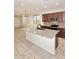 Open kitchen featuring dark cabinets, stainless appliances, and granite countertops at 10065 E Tiger Lily Ave, Mesa, AZ 85212