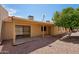 Enclosed back patio overlooking well-kept yard at 1021 S Greenfield Rd # 1077, Mesa, AZ 85206