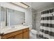 Bathroom featuring tiled shower and a vanity with a sink at 1021 S Greenfield Rd # 1077, Mesa, AZ 85206