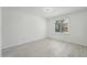 Bright bedroom with neutral paint, wood-look floors, and a window at 1021 S Greenfield Rd # 1077, Mesa, AZ 85206