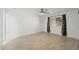 Bright bedroom with wood-look floors, ceiling fan, and window with curtains at 1021 S Greenfield Rd # 1077, Mesa, AZ 85206