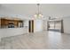 Open-concept living area boasts tile floors, ceiling fan, and access to the outdoor patio at 1021 S Greenfield Rd # 1077, Mesa, AZ 85206