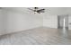 Bright and airy living room features tile flooring, ceiling fan, and modern lighting at 1021 S Greenfield Rd # 1077, Mesa, AZ 85206