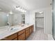 Bright bathroom features double sinks, generous counter space, and a separate shower and toilet area at 10410 N Cave Creek Rd # 1100, Phoenix, AZ 85020