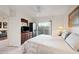 This main bedroom is spacious with natural light and balcony access at 10410 N Cave Creek Rd # 1100, Phoenix, AZ 85020