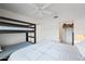 This bedroom has a bunk bed, queen bed and closet perfect for sleep and storage at 10410 N Cave Creek Rd # 1100, Phoenix, AZ 85020