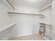 Organized walk-in closet with shelving and rods, offering ample storage space for clothing and accessories at 10410 N Cave Creek Rd # 1100, Phoenix, AZ 85020