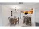 Bright dining area features a glass table with seating for four and adjoins the open concept kitchen at 10410 N Cave Creek Rd # 1100, Phoenix, AZ 85020