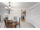 Bright dining area with pendant lighting, leading to a pantry and laundry area, creating a functional space at 10410 N Cave Creek Rd # 1100, Phoenix, AZ 85020