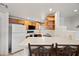 Inviting kitchen featuring wood cabinetry and a breakfast bar, perfect for casual meals and gathering at 10410 N Cave Creek Rd # 1100, Phoenix, AZ 85020