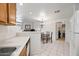 Bright kitchen with white counters and appliances offering a clear view of the dining and living areas at 10410 N Cave Creek Rd # 1100, Phoenix, AZ 85020