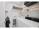 The laundry room includes a washer, dryer, shelving, and storage at 10410 N Cave Creek Rd # 1100, Phoenix, AZ 85020
