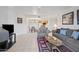 Bright living room featuring tile floors, stylish furnishings, and an open-concept design at 10410 N Cave Creek Rd # 1100, Phoenix, AZ 85020