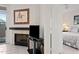 Inviting living room with a warm fireplace and serene bedroom view, ideal for tranquil living at 10410 N Cave Creek Rd # 1100, Phoenix, AZ 85020