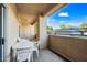 Private patio with a view, features white table and chairs for relaxing at 10410 N Cave Creek Rd # 1100, Phoenix, AZ 85020