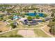 Community aerial view with a lake, fountain, playground, and parking areas at 1104 E Tekoa Ave, Gilbert, AZ 85298