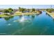 Aerial view of the lake with a fountain, gazebo, playground, and walking paths at 1104 E Tekoa Ave, Gilbert, AZ 85298