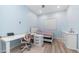 A well-lit bedroom boasts a study desk, a dresser, and a bed, offering a functional and relaxing space at 1104 E Tekoa Ave, Gilbert, AZ 85298