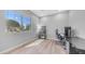 Bright bedroom with large window, light wood floors, and modern desk space at 1104 E Tekoa Ave, Gilbert, AZ 85298