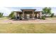 Exterior shot of a community center featuring stone pillars, lush landscaping, and easy access to walking paths and green spaces at 1104 E Tekoa Ave, Gilbert, AZ 85298