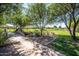 Scenic community park featuring a bridge, lush green space, walking path, and well-maintained landscaping for residents to enjoy at 1104 E Tekoa Ave, Gilbert, AZ 85298