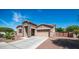 Beautiful single-story home with stone accents, well-kept yard, and a two-car garage at 1104 E Tekoa Ave, Gilbert, AZ 85298