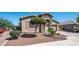 Lovely single-story home with desert landscaping, stone accents, and a two-car garage at 1104 E Tekoa Ave, Gilbert, AZ 85298