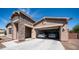 A spacious two-car garage with an open door has two parked vehicles at 1104 E Tekoa Ave, Gilbert, AZ 85298