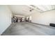Spacious garage with ample storage space and overhead lighting at 1104 E Tekoa Ave, Gilbert, AZ 85298