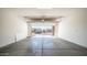 Spacious two-car garage with high ceilings and an open view to the neighborhood at 1104 E Tekoa Ave, Gilbert, AZ 85298