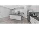 Bright kitchen with island, granite countertops, stainless steel appliances, and tiled floors at 1104 E Tekoa Ave, Gilbert, AZ 85298