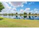 Picturesque lake with lush green surroundings and clear blue skies at 1104 E Tekoa Ave, Gilbert, AZ 85298