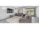 Bright living room features modern furniture, neutral colors, and sliding glass doors for natural light at 1104 E Tekoa Ave, Gilbert, AZ 85298