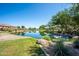Calm pond with lush landscaping, a decorative bridge, and serene surroundings at 1104 E Tekoa Ave, Gilbert, AZ 85298