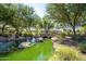 Scenic pond featuring a stone bridge, lush greenery, and tranquil water features at 1104 E Tekoa Ave, Gilbert, AZ 85298