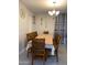Inviting dining room with seating for eight and decorative wall art at 11562 W Levi Dr, Avondale, AZ 85323