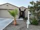 Charming single-story home featuring a well-maintained lawn and beautiful desert landscaping at 11562 W Levi Dr, Avondale, AZ 85323