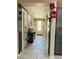 Inviting hallway with modern decor, elegant console table, and light-filled entryway at 11562 W Levi Dr, Avondale, AZ 85323