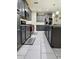 Contemporary kitchen with gray cabinets, subway tile backsplash, and stainless steel appliances at 11562 W Levi Dr, Avondale, AZ 85323